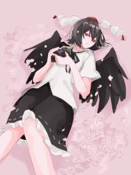 Rule 34 | 1girl, bird wings, black hair, black skirt, black wings, camera, cherry blossoms, expressionless, feathered wings, hat, highres, holding, holding camera, knees together feet apart, lying, on back, one-hour drawing challenge, petals, pink background, pom pom (clothes), red eyes, ribbon, shameimaru aya, short hair, skirt, solo, tohoyuukarin, tokin hat, touhou, wings