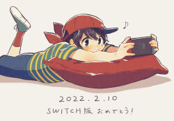 Rule 34 | 1boy, baseball cap, black eyes, black hair, blue shorts, blush, dated, fingernails, foot up, grey background, grey footwear, handheld game console, hat, holding, holding handheld game console, looking at object, lying, male focus, mother (game), mother 1, musical note, neckerchief, ninten, nintendo, nintendo switch, on stomach, pillow, red hat, red neckerchief, red socks, shifumame, shirt, short hair, short sleeves, shorts, sideways hat, socks, solo, striped clothes, striped shirt, translation request