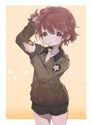Rule 34 | 1girl, adjusting hair, alisa (girls und panzer), alternate hairstyle, arm up, black shorts, border, brown eyes, brown hair, brown jacket, commentary, cowboy shot, emblem, freckles, girls und panzer, hair down, hair ornament, unworn hair ornament, hair tie in mouth, hand in own hair, highres, holding, holding hair ornament, jacket, long sleeves, looking at viewer, military, military uniform, mouth hold, orange background, outside border, saunders military uniform, short hair, short shorts, shorts, solo, standing, star (symbol), star hair ornament, tama launcher, uniform, white border