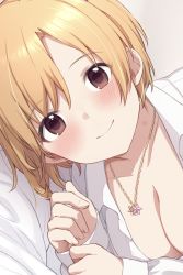 Rule 34 | 1girl, aiba yumi, bed sheet, blonde hair, blush, breasts, cleavage, collarbone, hickey, highres, hiraga matsuri, idolmaster, idolmaster cinderella girls, jewelry, looking at viewer, lying, medium breasts, naked shirt, necklace, on side, shirt, short hair, simple background, smile, solo, upper body