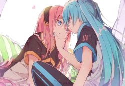 Rule 34 | 2girls, :t, blue eyes, blue hair, commentary, eye contact, hand on another&#039;s chin, hatsune miku, heads together, headband, heart, leaning forward, long hair, looking at another, megurine luka, multiple girls, nail polish, pants, pillow, pink hair, short sleeves, sitting, straight hair, track pants, twintails, twitter username, very long hair, vocaloid, wanaxtuco, yuri