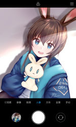 Rule 34 | 1girl, absurdres, amiya (arknights), animal ears, arknights, blue eyes, blue jacket, brown hair, commentary request, drop shadow, hair between eyes, highres, holding, holding stuffed toy, jacket, long sleeves, looking at viewer, open mouth, fake phone screenshot, puffy short sleeves, puffy sleeves, rabbit ears, selfie, short hair with long locks, short sleeves, solo, stuffed animal, stuffed rabbit, stuffed toy, translation request, upper body, white background, yolandabaka