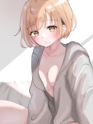 1girl blonde_hair blush breasts character_request closed_mouth copyright_request grey_shirt hair_between_eyes highres long_sleeves looking_at_viewer medium_breasts medium_hair shirt solo watano_yuki yellow_eyes