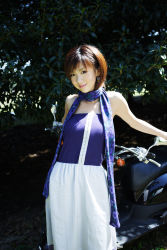 Rule 34 | 1girl, asian, dress, highres, hoshino aki, japanese (nationality), motor vehicle, outdoors, photo (medium), scarf, scooter, solo, strapless, strapless dress, vehicle