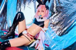 Rule 34 | 1boy, absurdres, astolfo (fate), astolfo (fate) (cosplay), black ribbon, boots, bulge, cosplay, fate/grand order, fate (series), hair ribbon, highres, latex, latex boots, latex legwear, latex panties, latex thighhigh boots, latex thong, latex top, looking at viewer, male focus, mouth hold, panties, photo (medium), pink hair, poker chip, purple eyes, ribbon, shiny skin, solo, testicle peek, trap, underwear, velvetchann