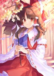 Rule 34 | 1girl, absurdres, blue neckwear, bow, brown hair, cheunes, commentary, cowboy shot, day, detached sleeves, flower, gohei, hair bow, hair tubes, hakurei reimu, highres, holding, light rays, long hair, long sleeves, looking at viewer, outdoors, red bow, red eyes, red skirt, red vest, skirt, solo, sunbeam, sunlight, touhou, vest
