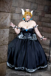 Rule 34 | 1girl, armlet, asian, bare shoulders, black collar, black dress, black nails, blonde hair, blue eyes, borrowed design, bowsette, bowsette (cosplay), bracelet, breasts, brooch, chouzuki maryou, cleavage, collar, cosplay, crown, dress, earrings, fingernails, highres, horns, jewelry, large breasts, long hair, looking at viewer, mario (series), nail polish, new super mario bros. u deluxe, nintendo, photo (medium), plump, shell, skirt, smile, solo, spiked armlet, spiked bracelet, spiked collar, spiked shell, spikes, standing, strapless, strapless dress, super crown, turtle shell