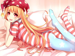 Rule 34 | 1girl, american flag dress, american flag legwear, ass, asymmetrical legwear, blonde hair, clownpiece, dress, feet, female focus, hat, highres, jester cap, long hair, looking at viewer, lying, no shoes, on bed, on stomach, open mouth, pantyhose, pillow, qunqing, red eyes, short dress, smile, solo, striped clothes, striped dress, touhou, uneven legwear