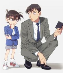 Rule 34 | 2boys, black-framed eyewear, black footwear, blazer, blue eyes, blue jacket, blue necktie, bow, bowtie, brown hair, child, collared shirt, commentary request, edogawa conan, formal, glasses, grey jacket, grey pants, grey shorts, grey suit, hair between eyes, hand on own chin, holding, holding notebook, jacket, k (gear labo), long sleeves, looking at another, looking down, male focus, meitantei conan, multiple boys, necktie, notebook, pants, red bow, red bowtie, serious, shadow, shirt, shoes, short hair, shorts, simple background, sneakers, squatting, standing, suit, takagi wataru (meitantei conan), thinking, white background, white shirt