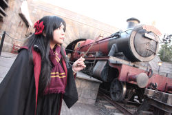 Rule 34 | 1girl, asian, black hair, bow, bracelet, brown eyes, chouzuki maryou, cloak, cosplay, hair bow, harry potter (series), highres, jewelry, locomotive, looking up, photo (medium), red bow, red scarf, scarf, solo, striped clothes, striped scarf, wand, wizarding world