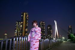 Rule 34 | 1girl, cityscape, hairband, japanese clothes, kimono, night, photo (medium), shio, sky, solo, strawberry pattern, water, waterfront