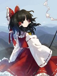 Rule 34 | 1girl, ascot, black hair, blue sky, brown eyes, closed mouth, day, detached sleeves, frilled hair tubes, frilled ribbon, frilled skirt, frills, gohei, hair ribbon, hair tubes, hakurei reimu, holding, holding gohei, long sleeves, looking back, medium hair, nontraditional miko, outdoors, red ribbon, red shirt, red skirt, retrochaossan, ribbon, ribbon-trimmed skirt, ribbon-trimmed sleeves, ribbon trim, shirt, skirt, sky, sleeveless, sleeveless shirt, sleeves past fingers, sleeves past wrists, solo, touhou, white sleeves, yellow ascot