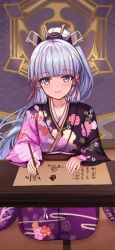 Rule 34 | 1girl, ayaka (genshin impact), blue eyes, blunt bangs, blush, breasts, brush, cleavage, floral print, genshin impact, hair ornament, highres, japanese clothes, kimono, large breasts, long hair, long sleeves, looking at viewer, mole, mole under eye, ponytail, scroll, sidelocks, sitting, smile, solo, split mouth, suangyue qiuhua, table, very long hair, wide sleeves, writing
