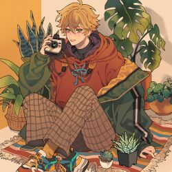 Rule 34 | 1boy, ahoge, arm support, basket, black shirt, blonde hair, blush, brown pants, camera, commentary, contemporary, earrings, english commentary, flower pot, genshin impact, green eyes, green jacket, hair between eyes, hand up, highres, holding, holding camera, hood, hood down, hoodie, indian style, jacket, jewelry, long sleeves, looking at viewer, male focus, misu 025, off shoulder, open clothes, open jacket, pants, parted lips, plant, polaroid, potted plant, puffy long sleeves, puffy sleeves, red hoodie, rug, shirt, shoes, short hair, sidelocks, simple background, sitting, sleeves past wrists, smile, sneakers, socks, solo, stud earrings, succulent plant, thoma (genshin impact), turtleneck, two-tone background, white background, yellow background, yellow socks, zipper
