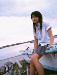 Rule 34 | 1girl, asian, bare legs, boat, dutch angle, kawamura yuki, long hair, looking at viewer, ocean, outdoors, photo (medium), pleated skirt, skirt, solo, tagme