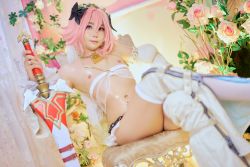 Rule 34 | 1boy, absurdres, astolfo (fate), astolfo (fate) (cosplay), cosplay, fate/grand order, fate (series), highres, looking at viewer, male focus, nipples, photo (medium), pink hair, purple eyes, sitting, solo, tattoo, trap, velvetchann