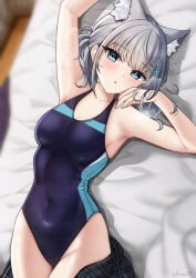 Rule 34 | 1girl, absurdres, animal ear fluff, animal ears, bed, black one-piece swimsuit, blue archive, blue eyes, breasts, competition swimsuit, covered navel, cross hair ornament, extra ears, from above, grey hair, hair ornament, halo, highres, looking at viewer, low ponytail, medium breasts, medium hair, mismatched pupils, multicolored clothes, multicolored swimsuit, nassss, official alternate costume, one-piece swimsuit, plaid, plaid skirt, shiroko (blue archive), shiroko (swimsuit) (blue archive), skirt, solo, swimsuit, wolf ears