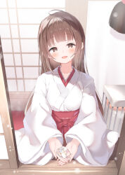 1girl :d absurdres blush breasts brown_eyes brown_hair collarbone hakama hakama_skirt head_tilt highres holding japanese_clothes kimono long_hair long_sleeves looking_at_viewer medium_breasts miko omamori open_mouth original outstretched_hand pov red_hakama shrine skirt smile snow solo ukiwakisen upper_body white_kimono wide_sleeves winter