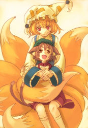 Rule 34 | 2girls, animal ears, animal hat, bad id, bad pixiv id, blonde hair, brown hair, cat ears, cat girl, cat tail, chen, fangs, female focus, fox tail, hat, hugging another&#039;s tail, kuronuko neero, large tail, long sleeves, looking at another, mob cap, multiple girls, multiple tails, open mouth, red eyes, short hair, socks, tail, hugging tail, tassel, touhou, wide sleeves, yakumo ran, yellow background