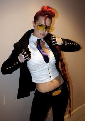 Rule 34 | 1girl, breasts, cosplay, crimson viper, crimson viper (cosplay), earrings, female focus, glasses, jewelry, large breasts, long hair, photo (medium), red hair, solo, standing, street fighter, sunglasses, tinted eyewear, yellow-tinted eyewear, yellow-tinted glasses
