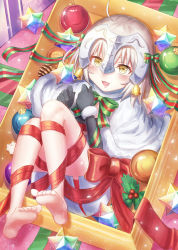 1girl ahoge bad_id bad_pixiv_id barefoot bell black_gloves blonde_hair blush bow christmas elbow_gloves fate/grand_order fate_(series) feet female_focus gloves headpiece highres jeanne_d&#039;arc_(fate) jeanne_d&#039;arc_alter_santa_lily_(fate) lying on_back open_mouth red_bow red_ribbon revision ribbon seungju_lee small_stellated_dodecahedron smile solo yellow_eyes