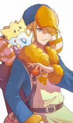 Rule 34 | 1boy, anidf, backpack, bag, belt, blonde hair, blue jumpsuit, brown bag, brown belt, closed mouth, commentary request, creatures (company), fur-trimmed jumpsuit, fur trim, game freak, gen 2 pokemon, grey eyes, hair over one eye, hand up, hat, highres, holding, holding poke ball, jumpsuit, long sleeves, male focus, nintendo, poke ball, poke ball (legends), pokemon, pokemon (creature), pokemon legends: arceus, short hair, simple background, smile, togepi, volo (pokemon), white background