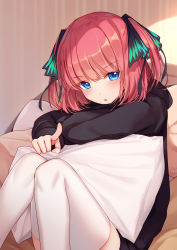 Rule 34 | 1girl, bison cangshu, black hoodie, blue eyes, go-toubun no hanayome, hair ornament, highres, hood, hood down, hoodie, knees together feet apart, knees up, long sleeves, looking at viewer, nakano nino, parted lips, pillow, pink hair, pointing, pointing at viewer, short hair, sitting, solo, thighhighs, two side up, white thighhighs