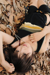 Rule 34 | 1girl, asian, bling, blurry, bra, breasts, brown eyes, brown hair, depth of field, jewelry, kipi-san, leaf, looking at viewer, lying, on floor, on ground, outdoors, pendant, photo (medium), ring, short hair, shorts, small breasts, solo, strap slip, tagme, tank top, underwear
