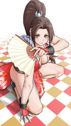 Rule 34 | 1girl, arm support, bare shoulders, breasts, brown eyes, brown hair, checkered floor, cleavage, closed mouth, commentary request, fatal fury, floral print, full body, hair ornament, hand fan, high ponytail, highres, holding, japanese clothes, kneeling, lips, long hair, looking at viewer, medium breasts, ninja, on one knee, parted bangs, pelvic curtain, ponytail, rope, shadow, shiranui mai, simple background, sleeveless, smile, solo, the king of fighters, thighs, x chitch