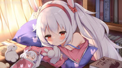 Rule 34 | 1girl, animal ears, azur lane, bare shoulders, blush, book, bookshelf, character doll, closed eyes, closed mouth, clothing request, commentary request, hairband, highres, hugging object, indoors, irokari, laffey (azur lane), long hair, looking at another, lying, pillow, pillow hug, rabbit, rabbit ears, red eyes, red hairband, room, shadow, silver hair, smile, solo, sunlight, under covers, window blinds, window shadow