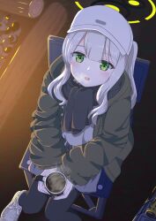 Rule 34 | 1girl, black pantyhose, black scarf, blue archive, blush, chair, coffee, cup, green eyes, green jacket, grey hair, grey shorts, halo, hare (blue archive), hare (camp) (blue archive), hat, highres, holding, holding cup, hood, hood down, hooded jacket, jacket, long hair, long sleeves, looking at viewer, official alternate costume, open mouth, pantyhose, ponytail, scarf, shoes, shorts, sitting, smile, solo, syimo, white footwear, white hat