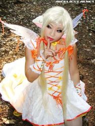 Rule 34 | angelicstar, blonde hair, bow, chii, chobits, clamp, cosplay, dress, lipstick, long dress, long hair, makeup, photo (medium), photo shoot, red lips, short twintails, twintails, wings, yaya han, yellow dress