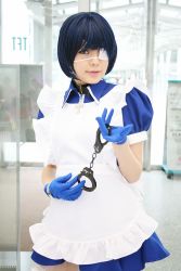 Rule 34 | 1girl, apron, asian, blue eyes, blue gloves, blue hair, collar, color contacts, cosplay, cross, cuffs, eyepatch, gloves, handcuffs, highres, ikkitousen, looking at viewer, maid, maid apron, namada, photo (medium), puffy short sleeves, puffy sleeves, ryomou shimei, ryomou shimei (cosplay), short sleeves, solo, standing