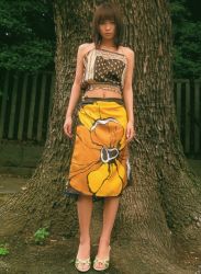 Rule 34 | 1girl, asian, bare legs, bare shoulders, brown hair, halterneck, ichikawa yui, looking at viewer, midriff, outdoors, photo (medium), shoes, skirt, solo, standing, tree