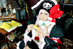 Rule 34 | 1girl, banana, breasts, captain liliana, captain liliana (cosplay), chouzuki maryou, cosplay, food, fruit, hat, large breasts, photo (medium), pink hair, pirate, pirate hat, plump, purple eyes, queen&#039;s blade, queen&#039;s blade lost worlds, queen&#039;s blade rebellion, sexually suggestive