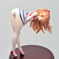 Rule 34 | 1girl, artist request, ass, ass focus, bent over, between legs, blue eyes, breasts, curvy, evangelion: 3.0+1.0 thrice upon a time, female focus, figure, full body, gloves, hand between legs, highres, huge ass, kneepits, legs, long hair, looking at viewer, looking back, neon genesis evangelion, photo (medium), plugsuit, rebuild of evangelion, skin tight, smile, solo, souryuu asuka langley, standing, thighs, tiptoes, two side up
