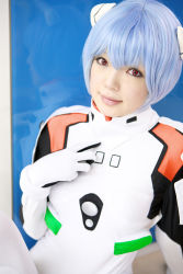 Rule 34 | 1girl, asian, ayanami rei, blue hair, breasts, color contacts, cosplay, hairpods, highres, looking at viewer, namada, neon genesis evangelion, photo (medium), plugsuit, plugsuit (cosplay), red eyes, short hair, small breasts, solo