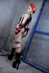 Rule 34 | 1girl, ahoge, airbrushed, ass, black theme, blonde hair, cammy white, cammy white (cosplay), capcom, cosplay, leotard, looking back, pantyhose, photo (medium), solo, street fighter