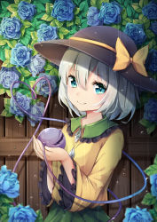 Rule 34 | 1girl, black hat, blue flower, blue rose, bow, commentary request, flower, frilled shirt collar, frilled sleeves, frills, green eyes, green hair, green skirt, hair between eyes, hand up, hat, hat bow, heart, heart of string, highres, holding, komeiji koishi, leaf, long sleeves, looking at viewer, partial commentary, rain, rose, shirt, short hair, skirt, smile, solo, third eye, touhou, umou (may65879), upper body, wide sleeves, yellow bow, yellow shirt