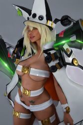 Rule 34 | 1girl, absurdres, arc system works, belt bra, blonde hair, breasts, breasts apart, cape, cosplay, fantastic nami, glowing, guilty gear, guilty gear xrd, hat, highres, lucifero (guilty gear), photo (medium), pubic tattoo, ramlethal valentine, real life, revealing clothes, star tattoo, sword, tattoo, underboob, weapon