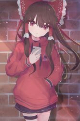 Rule 34 | 1girl, absurdres, alternate costume, black skirt, bow, brick wall, brown hair, closed mouth, commentary, contemporary, hair bow, hair tubes, hakurei reimu, hand in pocket, highres, holding, holding phone, hood, hoodie, long hair, long sleeves, looking at viewer, matcha yado, phone, red bow, red eyes, red hoodie, sidelocks, skirt, solo, standing, touhou, yin yang, yin yang print