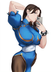 Rule 34 | 1girl, :o, arm behind head, blue dress, blueorca, bracelet, breasts, brown eyes, brown hair, capcom, cellphone, china dress, chinese clothes, chun-li, dress, earrings, gold trim, hair down, hair over shoulder, highres, holding, holding phone, jewelry, large breasts, long hair, looking at viewer, pantyhose, parted bangs, pelvic curtain, phone, sash, selfie, smartphone, solo, spiked bracelet, spikes, street fighter, thighs, white background