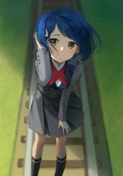Rule 34 | 1girl, adjusting hair, adjusting skirt, aeng dyu, black socks, blue hair, blush, bob cut, closed mouth, darling in the franxx, dress, feet out of frame, floating hair, foreshortening, grass, green eyes, grey dress, hair ornament, hair strand, hairclip, highres, ichigo (darling in the franxx), kneehighs, looking at viewer, looking up, messy hair, outdoors, perspective, pleated skirt, railroad tracks, raised eyebrows, red neckwear, shaded face, shadow, short hair, skirt, smile, socks, solo, uniform, wind