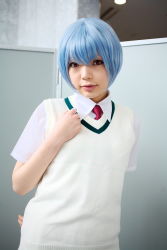 Rule 34 | 1girl, alternate costume, arm behind back, asian, ayanami rei, blue hair, breasts, color contacts, cosplay, highres, indoors, looking at viewer, namada, necktie, neon genesis evangelion, parted lips, photo (medium), red eyes, red necktie, school uniform, shirt, short hair, short sleeves, skirt, small breasts, solo, standing, sweater vest, white shirt