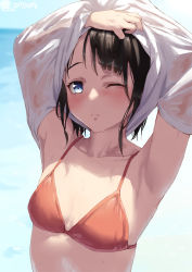1girl, armpits, artist name, bangs, bikini, black hair, blue eyes, blush, breasts, collarbone, commentary, jonsun, lifted by self, looking at viewer, nose blush, ocean, one eye closed, original, raised eyebrows, red bikini, see-through, shirt, shirt lift, short hair, small breasts, solo, swimsuit, twitter username, undressing, upper body, wet, wet clothes, wet hair, white shirt