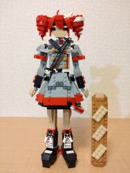 Rule 34 | 1girl, ahoge, arms at sides, baguette, black footwear, boots, bread, buttons, choroli (chorolin), double-breasted, drill hair, food, full body, grey jacket, grey skirt, hair between eyes, hair ribbon, highres, jacket, kasane teto, kasane teto (sv), lego (medium), long sleeves, looking at viewer, oversized food, oversized object, red eyes, red hair, ribbon, shoulder belt, skirt, solo, standing, straight-on, synthesizer v, twin drills, unconventional media, utau, white ribbon