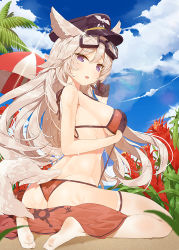 Rule 34 | 1girl, animal ears, ass, barefoot, bikini, black gloves, blonde hair, blush, breasts, cloud, company name, covering privates, covering breasts, day, flower, gloves, goggles, goggles on head, hat, large breasts, lens flare, long hair, looking at viewer, looking back, mx2j, non-web source, open mouth, orange bikini, outdoors, purple eyes, qurare magic library, sitting, sky, solo, swimsuit, tail, towel, umbrella, wariza