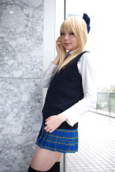Rule 34 | 1girl, against glass, asian, black thighhighs, blonde hair, blue eyes, blue ribbon, blurry, bow, breasts, character request, color contacts, cosplay, depth of field, dress shirt, hair bow, highres, indoors, looking at viewer, miniskirt, mole, mole under mouth, namada, necktie, photo (medium), plaid, plaid skirt, pleated skirt, ribbon, school uniform, shirt, skirt, small breasts, solo, standing, sweater vest, thighhighs, white shirt, window, zettai ryouiki