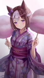 Rule 34 | 1girl, animal ears, blush, braid, brown hair, commentary request, cotton candy, cowboy shot, floral print, food, french braid, gradient background, grey background, grey hair, hands up, head tilt, highres, holding, holding food, horse ears, japanese clothes, kimono, long sleeves, looking at viewer, multicolored hair, obi, pink background, print kimono, purple eyes, purple kimono, purple sash, sash, short hair, solo, special week (umamusume), standing, two-tone hair, umamusume, wide sleeves, yoimoriyoru