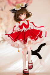 Rule 34 | 1girl, animal ears, bell, blurry, blurry background, brown eyes, brown hair, cat ears, cat girl, cat tail, character doll, chen, figure, full body, hat, highres, jingle bell, kneehighs, lace, lace-trimmed headwear, lace-trimmed shirt, lace trim, long sleeves, looking at viewer, mary janes, medium hair, miyako sasara, mob cap, multiple tails, neck ribbon, nekomata, open mouth, photo (medium), red footwear, red ribbon, red skirt, red vest, ribbon, shirt, shoes, skirt, skirt set, sleeves past wrists, smile, socks, solo, standing, standing on one leg, tail, touhou, two tails, vest, white ribbon, white shirt, white socks